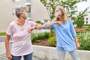 Family connecting with masks and hearing aids